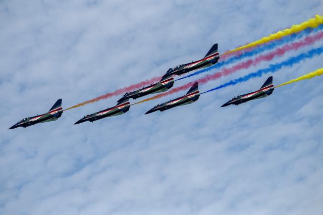 Aircraft of the Chinese People’s Liberation Army Air Force's Bayi aerobatic team perform an aerial display at the Singapore Airshow in Singapore on February 4, 2026. (Photo by Roslan RAHMAN / AFP)