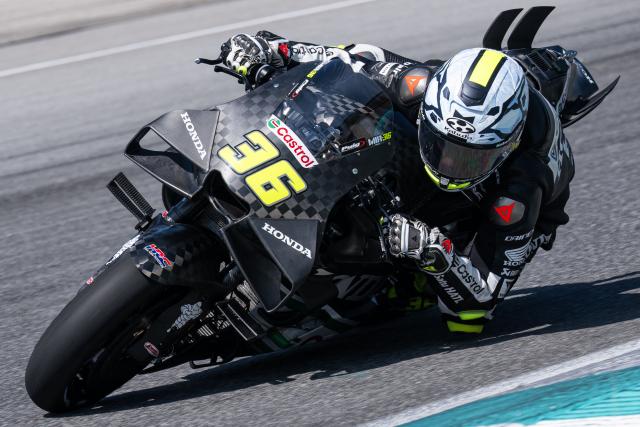 Honda HRC Castrol team's Spanish MotoGP rider Joan Mir takes a corner during the second day of the 2026 MotoGP pre-season test at the Sepang International Circuit in Sepang on February 4, 2026. (Photo by Mohd Rasfan / AFP)