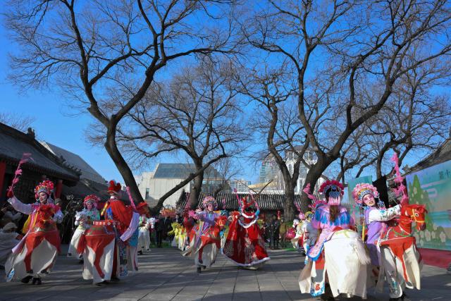 Dancers perform during the start of the Spring Culture Festival which falls on the day of Lichun, or the beginning of the first of the 24 solar terms in the Chinese calendar, at the Ancient Observatory building in Beijing on February 4, 2026. (Photo by Adek BERRY / AFP)
