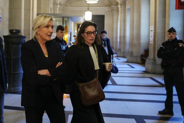 President of Rassemblement National parliamentary group Marine Le Pen (L) leaves with her lawyer Sandra Chirac Kollarik (R) during a break in the defense's closing argument in the trial of far-right party Rassemblement National (RN) former or actual members on charges of embezzlement of European public funds in a case of alleged European Parliament fake jobs at the Palais de Justice in Paris on February 4, 2026. The prosecution has requested confirmation of the five-year ban from holding public office against Marine Le Pen in the appeal trial in Paris of the RN MEPs' assistants. This sentence would prevent her from running for president in 2027. The decision of the Court of Appeal, which is not obliged to follow the requisitions, should be known by the summer. (Photo by Alain JOCARD / AFP)