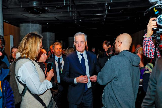 Prime Minister of Norway Jonas Gahr Store (C) arrives for the annual Arctic Frontiers conference in Tromsø on February 4, 2026. (Photo by Rune Stoltz Bertinussen / NTB / AFP) / Norway OUT
