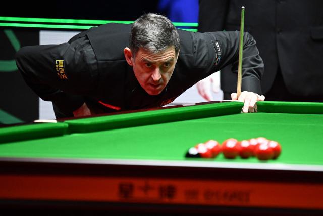 Britain's Ronnie O'Sullivan looks to play a shot against compatriot Joe O'Connor in round 1 of the Snooker World Grand Prix 2026 in Hong Kong on February 4, 2026. (Photo by Peter PARKS / AFP)