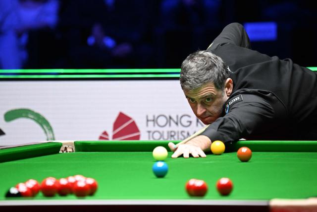 Englands Ronnie O'Sullivan plays a shot against compatriot Joe O'Connor in round 1 of the Snooker World Grand Prix 2026 in Hong Kong on February 4, 2026. (Photo by Peter PARKS / AFP)