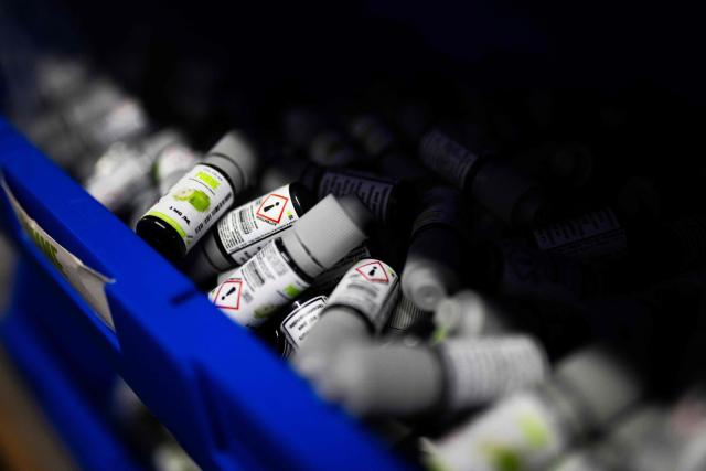 This photograph shows bottles of e-liquid for electronic cigarettes at the Fuu factory in Paris on February 3, 2026. (Photo by Julie SEBADELHA / AFP)
