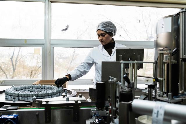 An employee checks bottles of e-liquid for electronic cigarettes, at the Fuu factory in Paris on February 3, 2026. (Photo by Julie SEBADELHA / AFP)