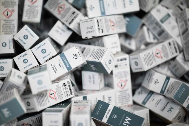 This photograph shows packages of bottles of e-liquid for electronic cigarettes at the Fuu factory in Paris on February 3, 2026. (Photo by Julie SEBADELHA / AFP)