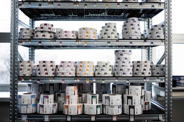This photograph shows labels for bottles of e-liquid for electronic cigarettes at the Fuu factory in Paris on February 3, 2026. (Photo by Julie SEBADELHA / AFP)