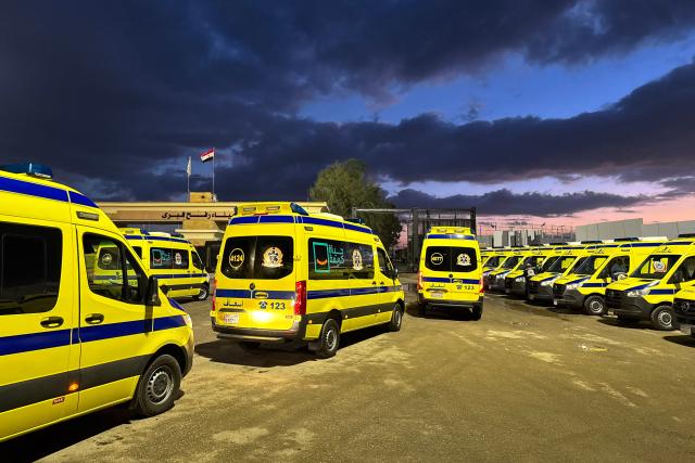 Ambulances wait on the Egyptian side of the Rafah border crossing with the Gaza Strip on February 4, 2026, days after Israel permitted a limited reopening of the Palestinian territory's border post. The crossing, which is Gaza's only gateway to the outside world that does not lead to Israel, had been largely closed since Israeli forces seized control of it in May 2024 during the war with Hamas. (Photo by AFP)