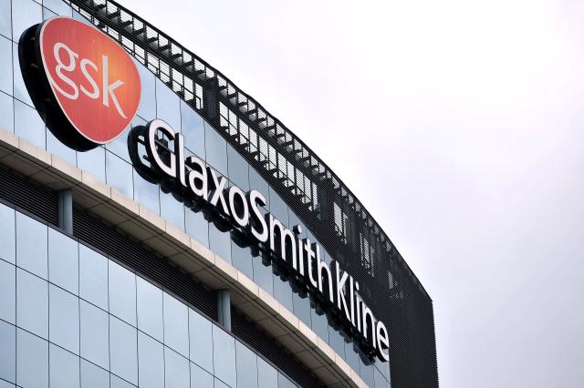 (FILES) The headquarters of pharmaceutical company GlaxoSmithKline is pictured in west London on July 29, 2013. British pharmaceutical group GSK reported on February 4, 2026 a sharp rise in net profit last year, boosted by strong HIV, respiratory and cancer drug sales as it recovered from costly US lawsuits over its Zantac heartburn drug. (Photo by Ben STANSALL / AFP)
