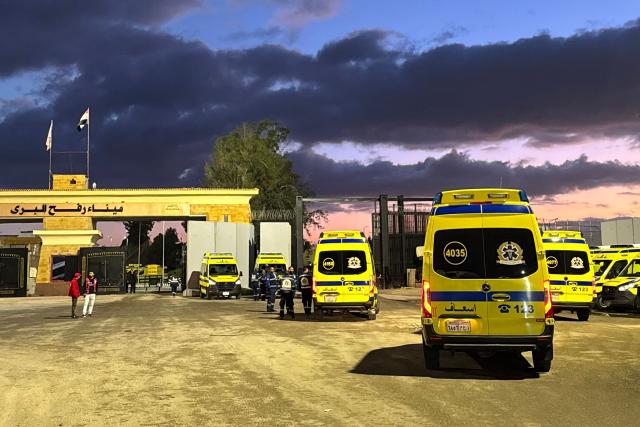 Ambulances wait on the Egyptian side of the Rafah border crossing with the Gaza Strip on February 4, 2026, days after Israel permitted a limited reopening of the Palestinian territory's border post. The crossing, which is Gaza's only gateway to the outside world that does not lead to Israel, had been largely closed since Israeli forces seized control of it in May 2024 during the war with Hamas. (Photo by AFP)