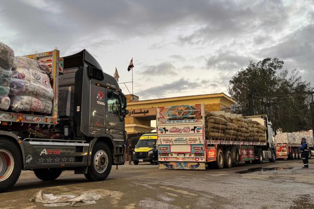 Humanitarian aid trucks enter through the Egyptian side of the Rafah border crossing with the Gaza Strip on February 4, 2026, days after Israel permitted a limited reopening of the Palestinian territory's border post. The crossing, which is Gaza's only gateway to the outside world that does not lead to Israel, had been largely closed since Israeli forces seized control of it in May 2024 during the war with Hamas. (Photo by AFP)