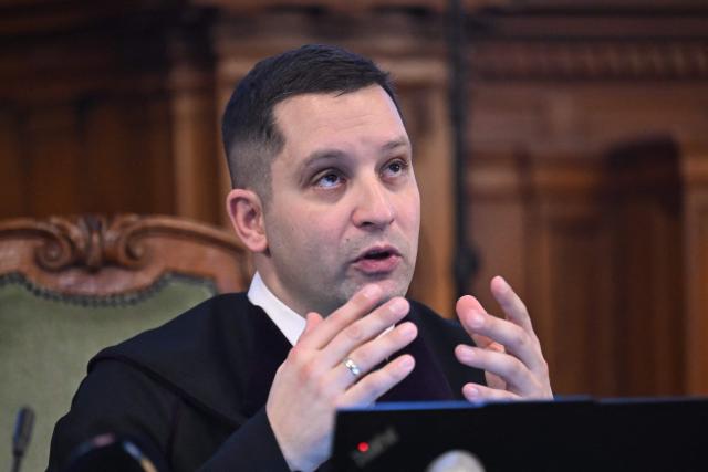 Hungarian judge Jozsef Sos sits in the courtroom in Budapest on February 4, 2026, as the court is expected to give its verdict in the case for allegedly participating in attacks against presumed neo-Nazis on the streets of the Hungarian capital. A Hungarian court in Budapest is expected to give a verdict on January 4, 2026 in the case of Maja T., a non-binary anti-fascist activist from Germany, who faces up to 24 years in jail on charges of assault in a closely watched and controversial trial. The German constitutional court has slammed the 2024 estradition of Maja T., 25, over potentially dangerous prison conditions in Hungary, especially for LGBTQ people. (Photo by Attila KISBENEDEK / AFP)