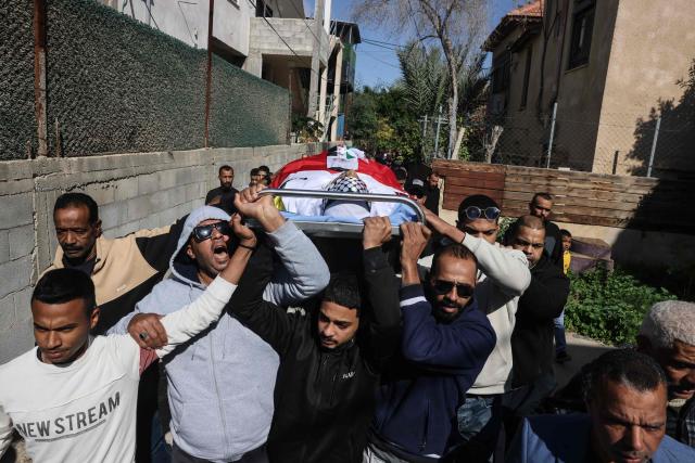 Mourners carry the body of Saeed Nael al-Sheikh, a 24-year-old Palestinian who was reportedly killed by Israeli forces, during his funeral in the city of Jericho in the Israeli-occupied West Bank on February 4, 2026. Palestinian health officials said on February 3, that Israeli forces shot dead a Palestinian man and wounded three others in the occupied West Bank city of Jericho. The Israeli military said soldiers opened fire after "rocks" were thrown at them. (Photo by AHMAD GHARABLI / AFP)