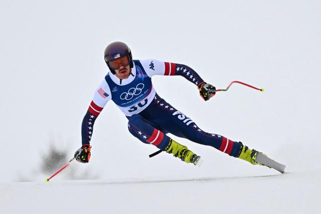 US' Bryce Bennett competes in the first official training for the men's downhill alpine skiing event ahead of the Milano Cortina 2026 Winter Olympic Games at the Stelvio Ski Centre in Bormio (Valtellina) on February 4, 2026. (Photo by Fabrice COFFRINI / AFP)