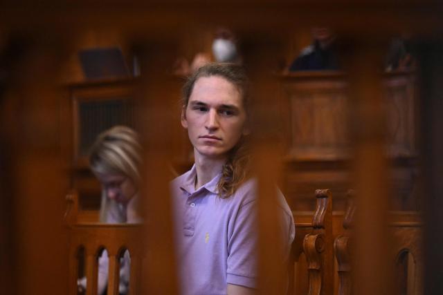 The defendant, German anti-fascist activist Maja T, waits in the courtroom in Budapest on February 4, 2026, as the court is expected to give its verdict in her case for allegedly participating in attacks against presumed neo-Nazis on the streets of the Hungarian capital. A Hungarian court in Budapest is expected to give a verdict on January 4, 2026 in the case of Maja T., a non-binary anti-fascist activist from Germany, who faces up to 24 years in jail on charges of assault in a closely watched and controversial trial. The German constitutional court has slammed the 2024 estradition of Maja T., 25, over potentially dangerous prison conditions in Hungary, especially for LGBTQ people. (Photo by Attila KISBENEDEK / AFP)