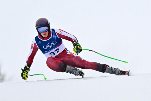 Canada's Riley Seger competes in the first official training for the men's downhill alpine skiing event ahead of the Milano Cortina 2026 Winter Olympic Games at the Stelvio Ski Centre in Bormio (Valtellina) on February 4, 2026. (Photo by Fabrice COFFRINI / AFP)
