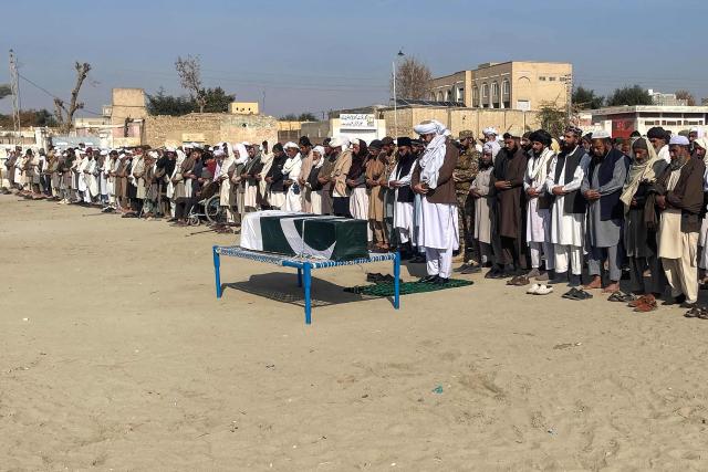 Relatives and security personnel offer funeral prayers for a paramilitary soldier killed in a Baloch separatists attack, in Lakki Marwat on February 4, 2026. Pakistan's security forces have killed almost 200 separatist insurgents in southwestern Balochistan province since they launched a wave of attacks over the weekend, a security official said on February 4, taking the overall death toll past 250. (Photo by Marwat AKBAR / AFP)