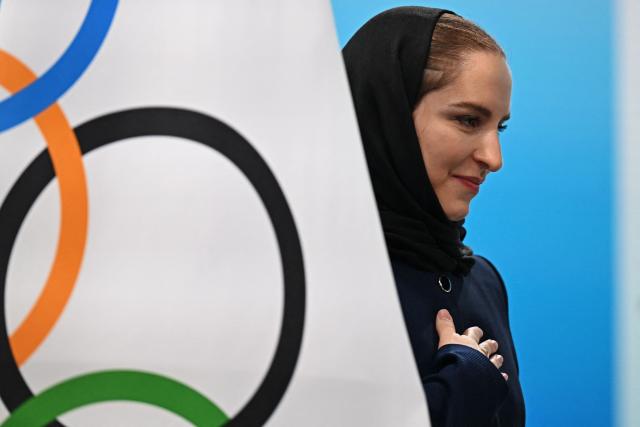 Iranian badminton player Soraya Aghaei Hajiagha, attends her oath ceremony as the newly appointed member of International Olympic Committee (IOC) during the 145th IOC session ahead of the Milano Cortina 2026 Winter Olympic Games, in Milan on February 4, 2026. (Photo by Piero CRUCIATTI / AFP)