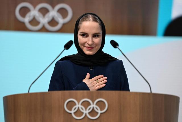 Iranian badminton player Soraya Aghaei Hajiagha, attends her oath ceremony as the newly appointed member of International Olympic Committee (IOC) during the 145th IOC session ahead of the Milano Cortina 2026 Winter Olympic Games, in Milan on February 4, 2026. (Photo by Piero CRUCIATTI / AFP)
