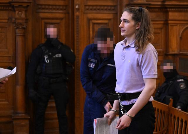 The defendant, German anti-fascist activist Maja T, addresses the court in the courtroom in Budapest on February 4, 2026, as the court is expected to give its verdict in her case for allegedly participating in attacks against presumed neo-Nazis on the streets of the Hungarian capital. A Hungarian court in Budapest is expected to give a verdict on January 4, 2026 in the case of Maja T., a non-binary anti-fascist activist from Germany, who faces up to 24 years in jail on charges of assault in a closely watched and controversial trial. The German constitutional court has slammed the 2024 estradition of Maja T., 25, over potentially dangerous prison conditions in Hungary, especially for LGBTQ people. (Photo by Attila KISBENEDEK / AFP)