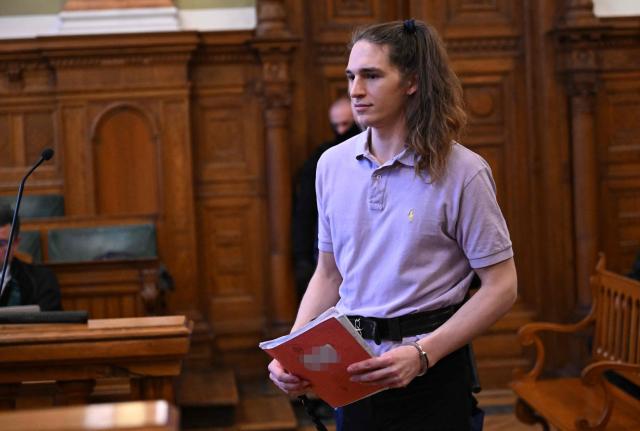 The defendant, German anti-fascist activist Maja T, addresses the court in the courtroom in Budapest on February 4, 2026, as the court is expected to give its verdict in her case for allegedly participating in attacks against presumed neo-Nazis on the streets of the Hungarian capital. A Hungarian court in Budapest is expected to give a verdict on January 4, 2026 in the case of Maja T., a non-binary anti-fascist activist from Germany, who faces up to 24 years in jail on charges of assault in a closely watched and controversial trial. The German constitutional court has slammed the 2024 estradition of Maja T., 25, over potentially dangerous prison conditions in Hungary, especially for LGBTQ people. (Photo by Attila KISBENEDEK / AFP)