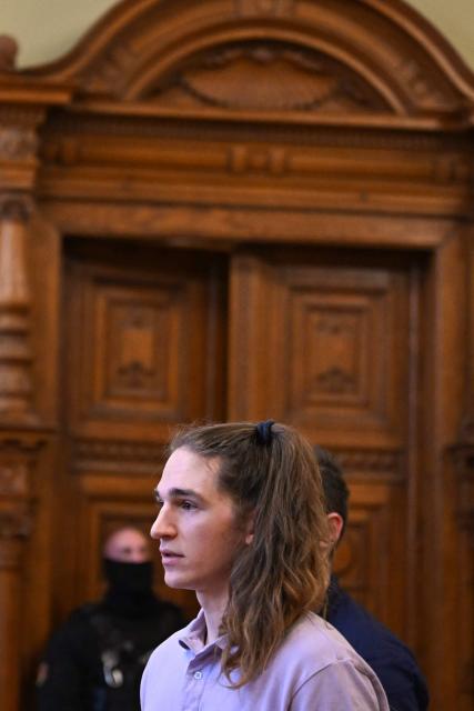 The defendant, German anti-fascist activist Maja T, addresses the court in the courtroom in Budapest on February 4, 2026, as the court is expected to give its verdict in her case for allegedly participating in attacks against presumed neo-Nazis on the streets of the Hungarian capital. A Hungarian court in Budapest is expected to give a verdict on January 4, 2026 in the case of Maja T., a non-binary anti-fascist activist from Germany, who faces up to 24 years in jail on charges of assault in a closely watched and controversial trial. The German constitutional court has slammed the 2024 estradition of Maja T., 25, over potentially dangerous prison conditions in Hungary, especially for LGBTQ people. (Photo by Attila KISBENEDEK / AFP)