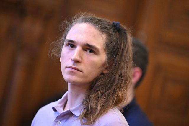 The defendant, German anti-fascist activist Maja T, looks on in the courtroom in Budapest on February 4, 2026, as the court is expected to give its verdict in her case for allegedly participating in attacks against presumed neo-Nazis on the streets of the Hungarian capital. A Hungarian court in Budapest is expected to give a verdict on January 4, 2026 in the case of Maja T., a non-binary anti-fascist activist from Germany, who faces up to 24 years in jail on charges of assault in a closely watched and controversial trial. The German constitutional court has slammed the 2024 estradition of Maja T., 25, over potentially dangerous prison conditions in Hungary, especially for LGBTQ people. (Photo by Attila KISBENEDEK / AFP)