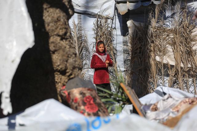 A girl looks at the damage following a reported Israeli strike on a camp housing displaced Palestinians in Khan Yunis in the southern Gaza Strip on February 4, 2026. Despite a US-brokered truce entering its second phase last month, violence has continued in the Gaza Strip, with Israel and Hamas accusing each other of breaching the agreement. (Photo by Bashar Taleb / AFP)