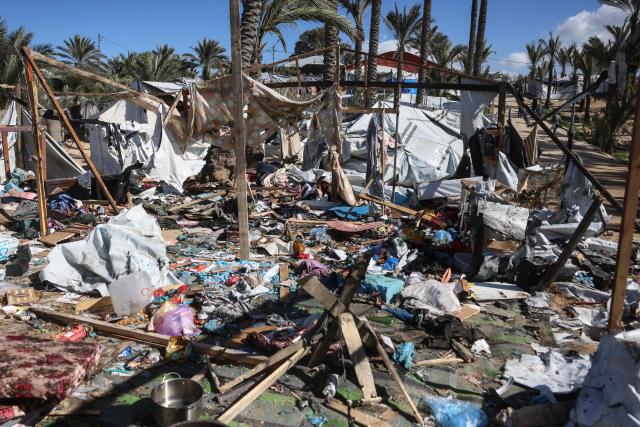A photograph shows the damage following a reported Israeli strike on a camp housing displaced Palestinians in Khan Yunis in the southern Gaza Strip on February 4, 2026. Despite a US-brokered truce entering its second phase last month, violence has continued in the Gaza Strip, with Israel and Hamas accusing each other of breaching the agreement. (Photo by Bashar Taleb / AFP)