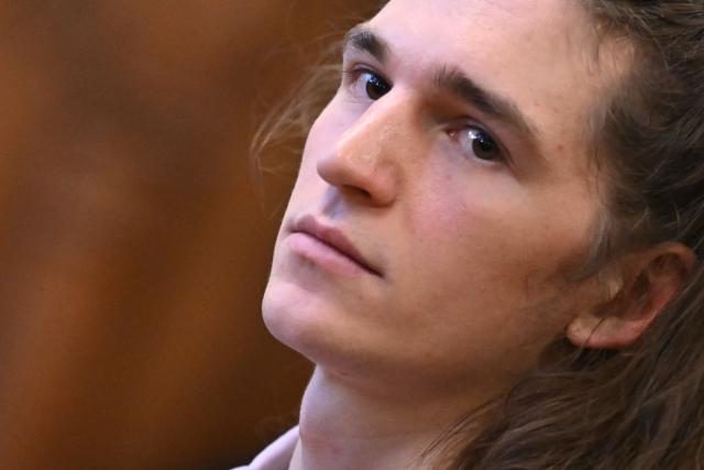 The defendant, German anti-fascist activist Maja T, looks on in the courtroom in Budapest on February 4, 2026, as the court is expected to give its verdict in her case for allegedly participating in attacks against presumed neo-Nazis on the streets of the Hungarian capital. In the trial over an attack on right-wing extremists in Hungary, German activist Maja T. has been sentenced to eight years in prison. A court in Budapest found the 25-year-old non-binary person guilty on Wednesday of having attacked participants in a right-wing extremist march in Budapest in February 2023 together with other left-wing extremists. (Photo by Attila KISBENEDEK / AFP)