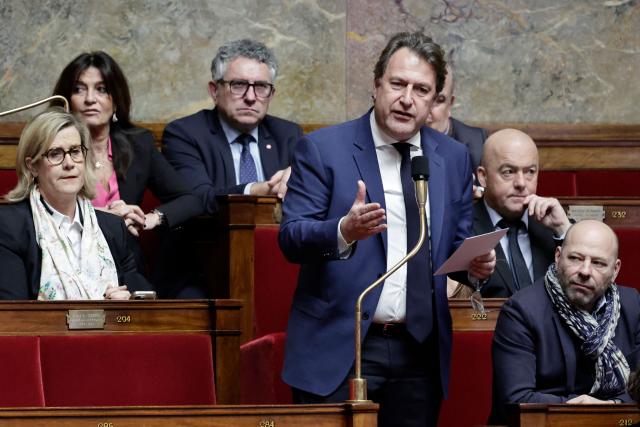 Horizons & Independants' MP Sylvain Berrios (C) speaks as fellow MPs (From Top L) Marie-Agnes Poussier-Winsback, Nathalie Colin-Oesterle, Thierry Benoit and Vincent Thiebaut listen during a session of questions to the government at the National Assembly, French Parliament's lower house, in Paris on February 4, 2026. (Photo by STEPHANE DE SAKUTIN / AFP)