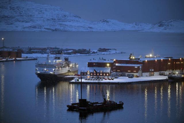 An overnight accommodation ship for Danish soldiers (L) is pictured at the harbour of Nuuk, western Greenland, on February 4, 2026. (Photo by Ina FASSBENDER / AFP)