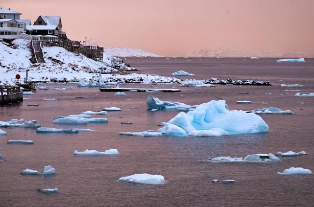 Floating ice is seen at the coastline of the city in Nuuk, western Greenland, on February 4, 2026. (Photo by Ina FASSBENDER / AFP)