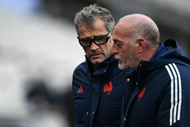 France's head coach Fabien Galthiй (L) speaks with France's attack coach Patrick Arlettaz during the captain’s run on the eve of the Six Nations rugby union match between France and Ireland at the Stade de France in Saint-Denis, near Paris, on February 4, 2026. (Photo by Julie SEBADELHA / AFP)