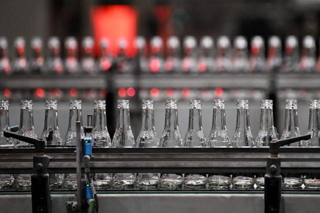 Newly manufactured bottles are prepped for filling at a factory run by British glass containers maker and filler, Encirc, in Elton, north-west England on February 4, 2026. (Photo by Paul ELLIS / AFP)