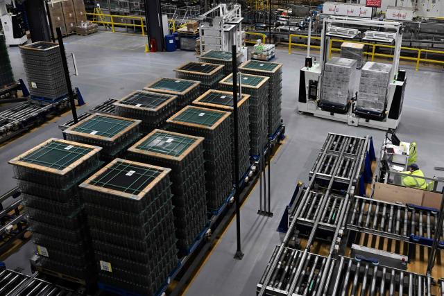 Crates of newly manufactured bottles are pictured at a factory run by British glass containers maker and filler, Encirc, in Elton, north-west England on February 4, 2026. (Photo by Paul ELLIS / AFP)