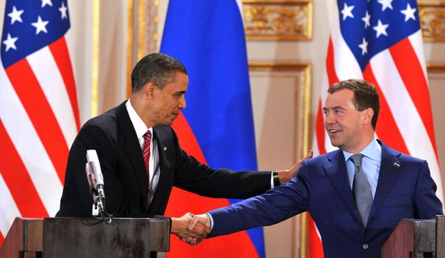 (FILES) Russia's President Dmitry Medvedev (R) shakes hands with US President Barack Obama (L) during a news conference after a signing a landmark nuclear disarmament treaty at Prague Castle, Prague on April 8, 2010. Russia vowed on February 4, 2026,  to act "responsibly" should its last nuclear treaty with the United States expire on February 5, amid mounting fears the agreement's collapse could spur a new arms race between the top nuclear powers. The New START agreement, signed in 2010, limits the number of nuclear warheads each side can deploy. (Photo by Yuri KADOBNOV / AFP)