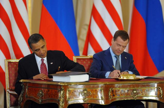 (FILES) US President Barack Obama (R) and Russian President Dmitry Medvedev sign a treaty cutting their nations' nuclear arsenals at Prague Castle, Prague on April 8, 2010. Russia vowed on February 4, 2026,  to act "responsibly" should its last nuclear treaty with the United States expire on February 5, amid mounting fears the agreement's collapse could spur a new arms race between the top nuclear powers. The New START agreement, signed in 2010, limits the number of nuclear warheads each side can deploy. (Photo by Jewel SAMAD / AFP)