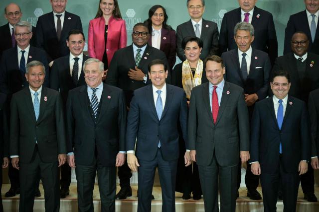 In front row, US Secretary of State Marco Rubio (C), flanked by Italian Foreign Minister Antonio Tajani (2L) and Polish Foreign Minister Radoslaw Sikorski (2R), participate in a family photo with invited officials during the inaugural Critical Minerals Ministerial meeting at the Sate Department in Washington, DC, on February 4, 2026. (Photo by Oliver Contreras / AFP)
