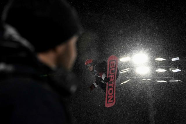 An athlete trains ahead of the snowboard big air qualifications during the Milano Cortina 2026 Winter Olympic Games at Livigno Snow Park, in Livigno (Valtellina), on February 4, 2026. (Photo by Jeff PACHOUD / AFP)