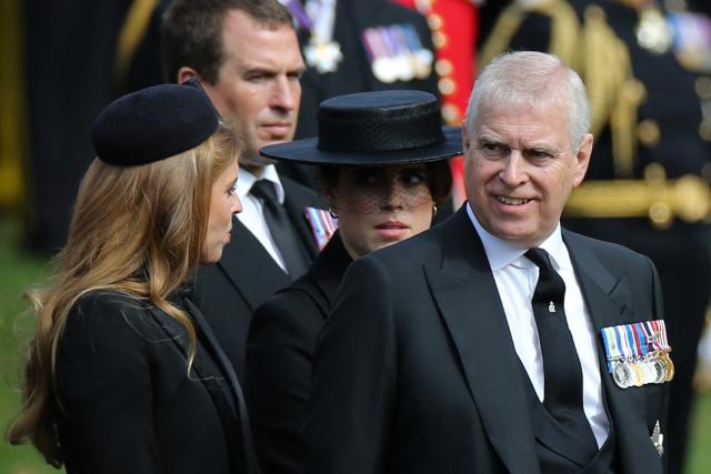 (FILES) Britain's Princess Beatrice of York (L), Peter Phillips (2nd L), Britain's Princess Eugenie of York (2nd R) and Britain's Prince Andrew, Duke of York (R) chat at Wellington Arch in London on September 19, 2022, after the State Funeral Service of Britain's Queen Elizabeth II. Britain's former prince Andrew is under intense pressure to explain his close ties to  late American financier Jeffrey Epstein after the US Justice Department released a new batch of documents on January 30, 2026. Andrew, who has strenuously denied any wrongdoing, was ousted from his Windsor mansion home alongside his ex-wife Sarah Ferguson, also tarnished by the Epstein affair, earlier than planned the BBC reported on February 4, 2026. (Photo by ISABEL INFANTES / AFP)