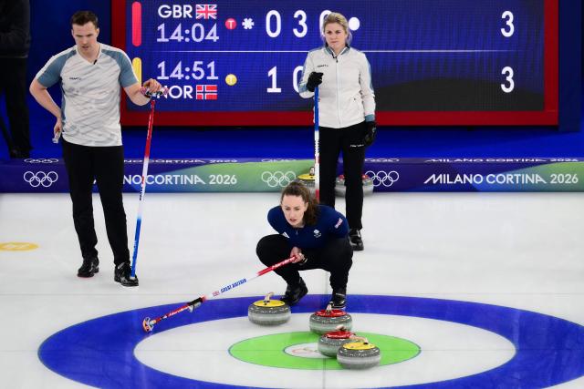 (From L) Norway's Magnus Nedregotten, Britain's Jennifer Dodds and Norway's Kristin Skaslien compete in the curling mixed doubles round robin between Britain and Norway during the Milano Cortina 2026 Winter Olympic Games at the Cortina Curling Olympic Stadium in Cortina d’Ampezzo on February 4, 2026. (Photo by Marco BERTORELLO / AFP)