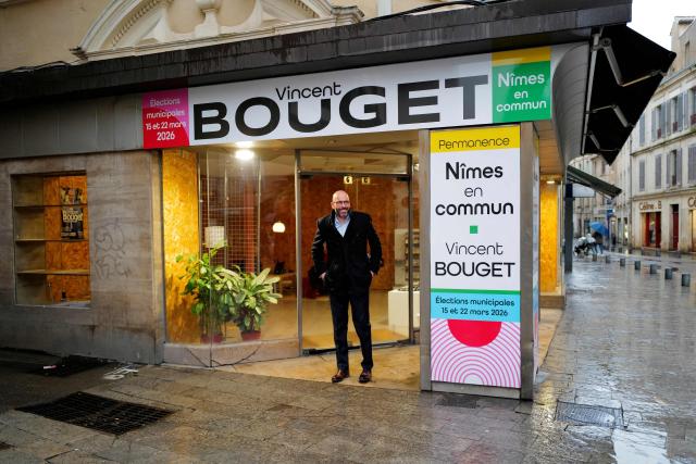 Nimes' City Councillor and candidate for mayor of Nimes, Vincent Bouget poses during a photo session at the entrance of his campaign headquarters in Nimes, southern France on February 4, 2026. (Photo by Sylvain THOMAS / AFP)