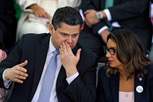 The President of the Federal Senate Davi Alcolumbre (L) speaks with Brazil's First Lady Janja Lula da Silva during the launching ceremony of the Brazil Pact to Combat Femicide at the Planalto Palace in Brasilia on February 4, 2026. (Photo by Sergio Lima / AFP)