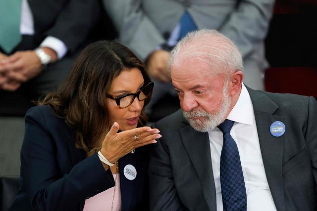 Brazil's President Luiz Inacio Lula da Silva (R) listens to his wife Brazil's First Lady Janja Lula da Silva during the launching ceremony of the Brazil Pact to Combat Femicide at the Planalto Palace in Brasilia, Brazil, February 4, 2026. (Photo by Sergio Lima / AFP)