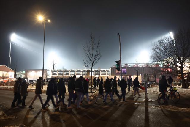 Fans are seen on their way to the Holstein-Stadium prior to the start of the German Cup (DFB-Pokal) quartefinal football match between Holstein Kiel and VfB Stuttgart in Kiel, northern Germany on February 4, 2026. (Photo by Ibrahim OT / AFP) / DFB REGULATIONS PROHIBIT ANY USE OF PHOTOGRAPHS AS IMAGE SEQUENCES AND QUASI-VIDEO.