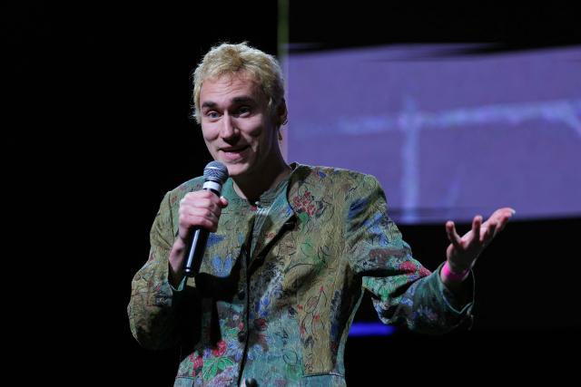 French humorist Mathieu Saïkaly addresses the audience during a French trade union General Confederation of Labour (CGT) meeting for trade union freedoms in Montreuil, near Paris on February 4, 2026. (Photo by Thomas SAMSON / AFP)