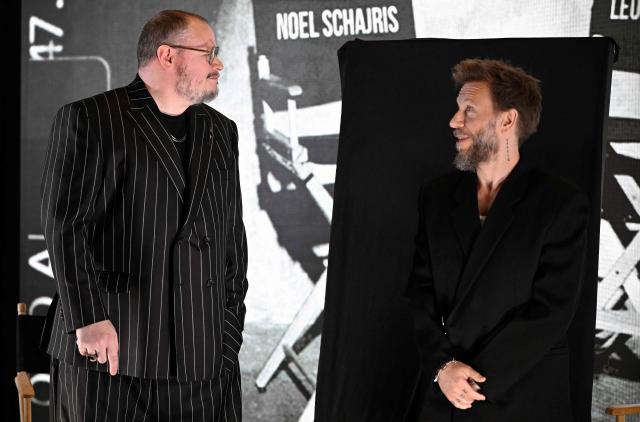 Leonel Garcia (L) and Noel Schajris of the Mexican musical duo Sin Bandera joke around before the presentation of their latest album, titled "Escenas", at the St. Regis Hotel in Mexico City on February 4, 2026. (Photo by Alfredo ESTRELLA / AFP)
