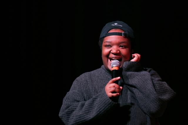 Humorist and radio host Mamari Munezero addresses the audience during a French trade union General Confederation of Labour (CGT) meeting for trade union freedoms in Montreuil, near Paris on February 4, 2026. (Photo by Thomas SAMSON / AFP)