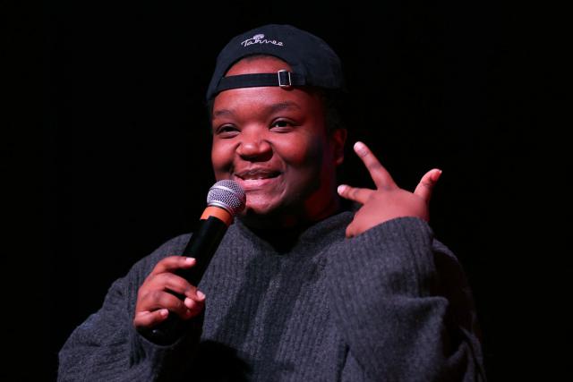 Humorist and radio host Mamari Munezero addresses the audience during a French trade union General Confederation of Labour (CGT) meeting for trade union freedoms in Montreuil, near Paris on February 4, 2026. (Photo by Thomas SAMSON / AFP)